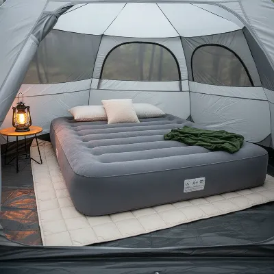 An air mattress placed on a clean, smooth surface with a protective layer underneath, in a tent or room